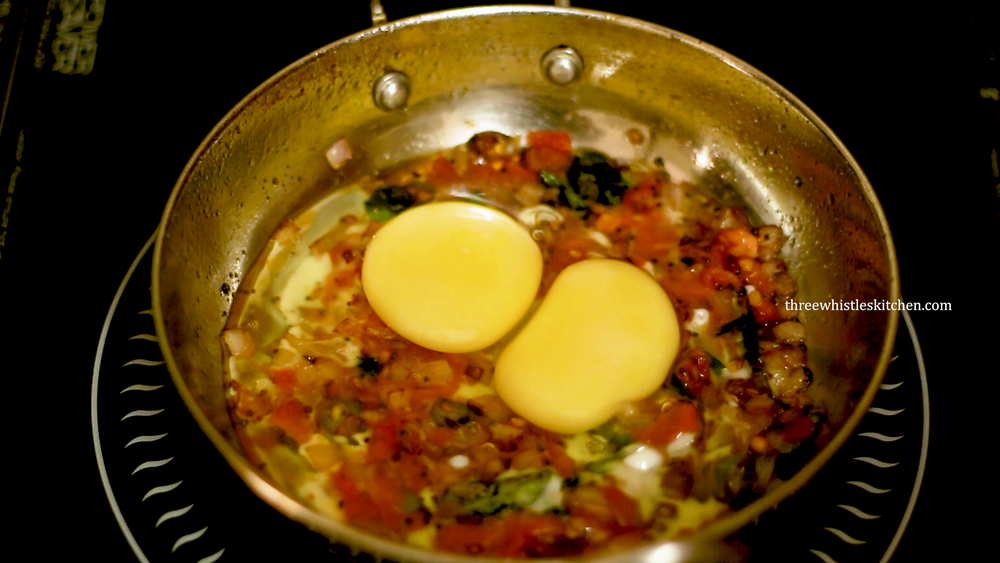 add eggs to onion & tomato