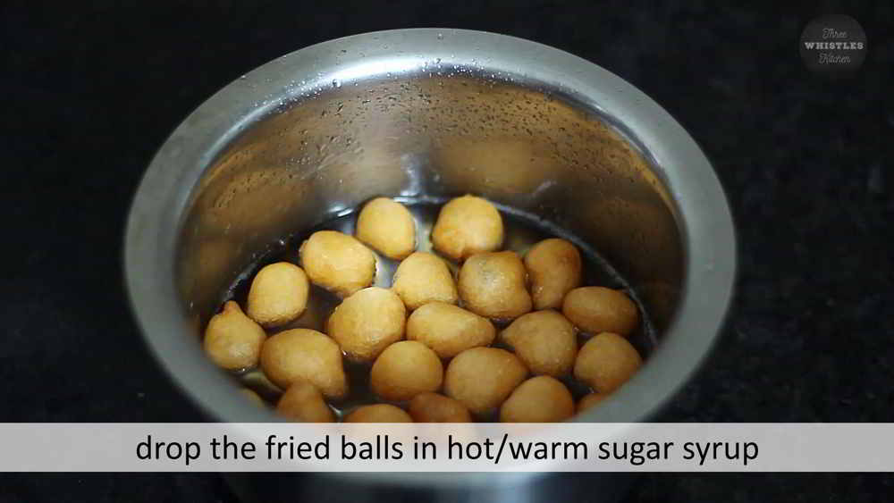 drop fried balls in sugar syrup thenu mittai