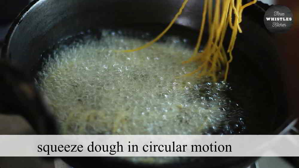 squeeze dough in hot oil